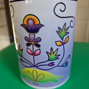 beautiful cup with flower graphics from Thailand signed on bottom.